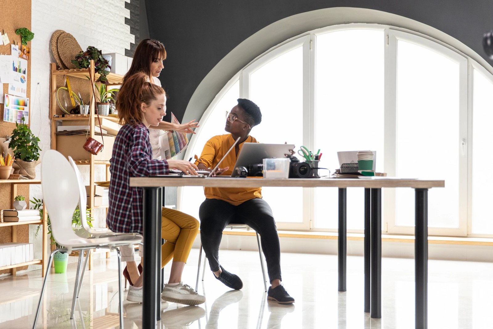 Creative entrepreneurs discussing website planning in a meeting