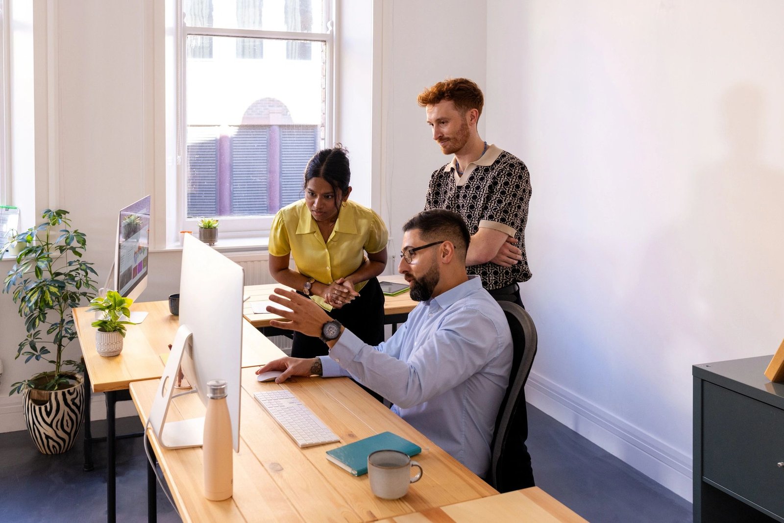 Business team reviewing website strategy on a computer screen