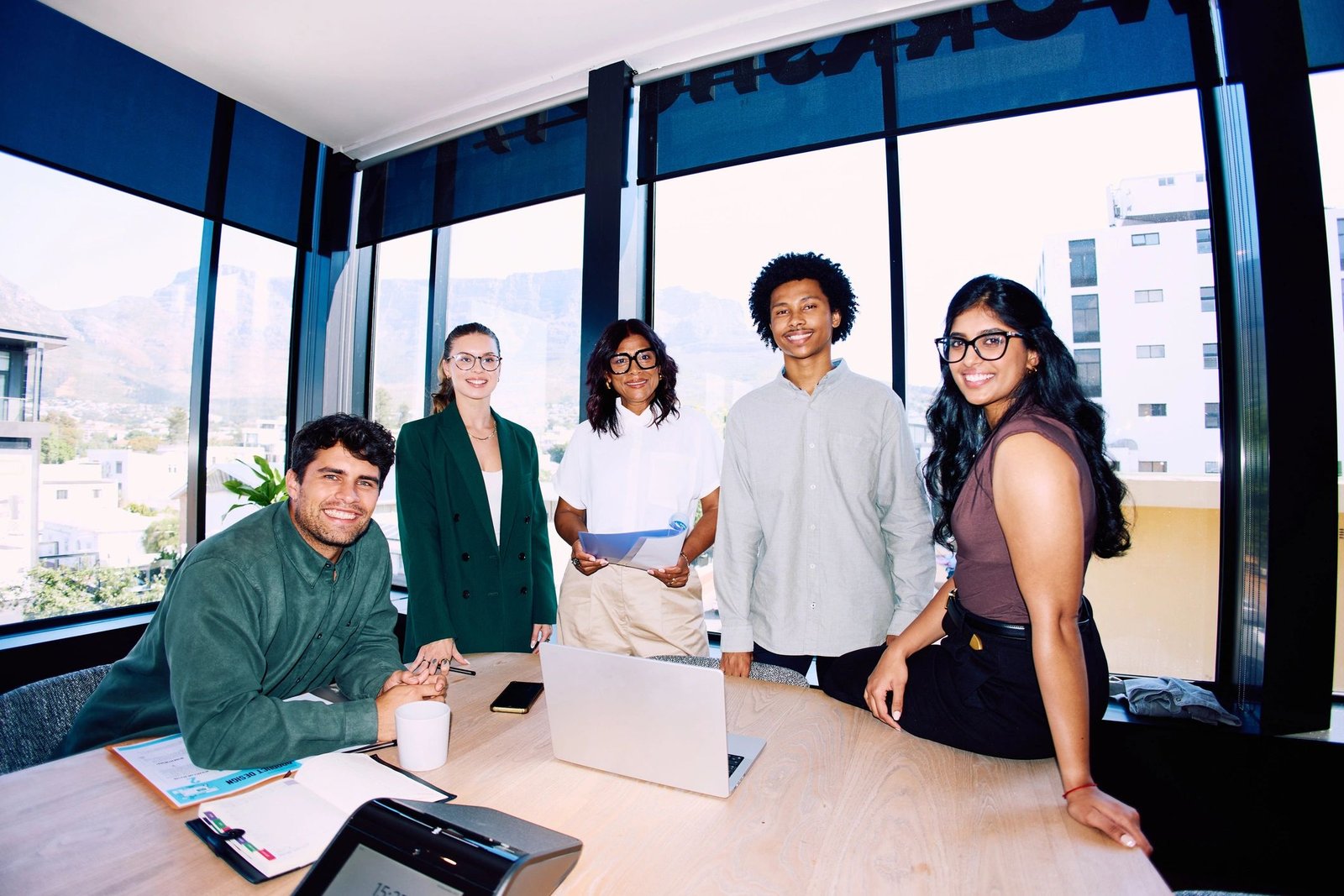Business team gathered around a meeting table